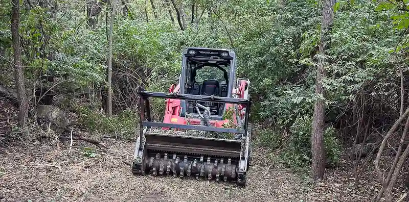 Land clearing and brush clearing equipment work near Kingsville Missouri